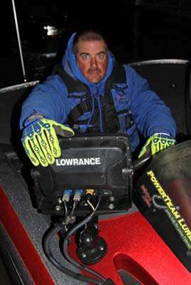 Kentucky boater Mike Boggs keeps his hands warm with fluorescent gloves at the Day 1 launch on Lake Eufaula.