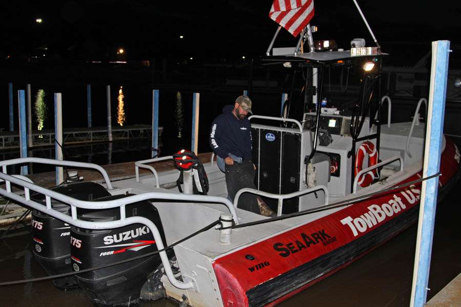 Jackson Dozier dons his slickers as he prepares to launch the Tow Boat U.S. checkout vessel.