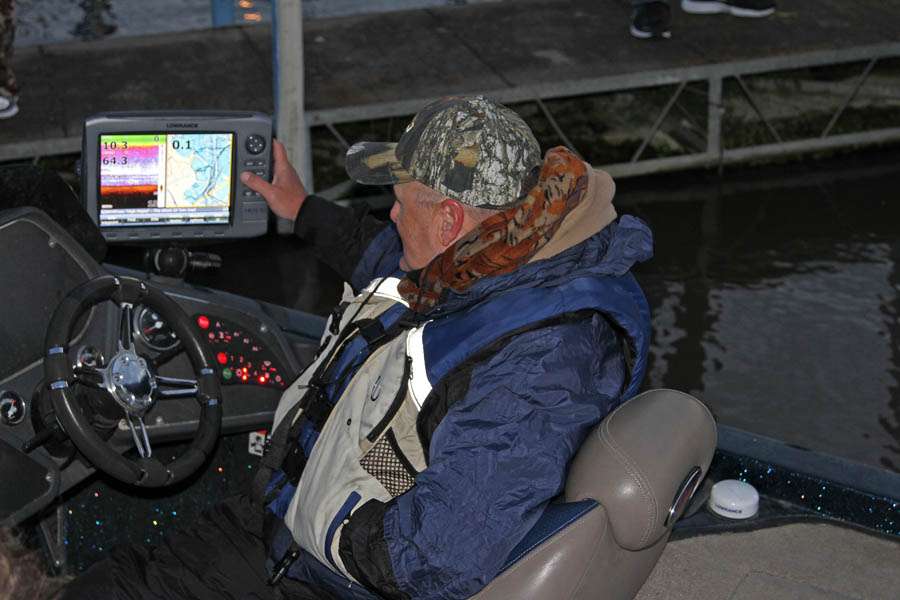  Jack Smith, whose 7-pounder was the Day 1 big bass, looks over his electronics as he preps for Day 2.