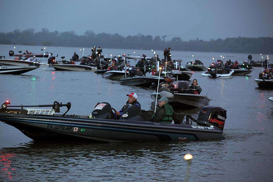The first flight of boats lines up in place to begin a day of fishing on the Red River. 
