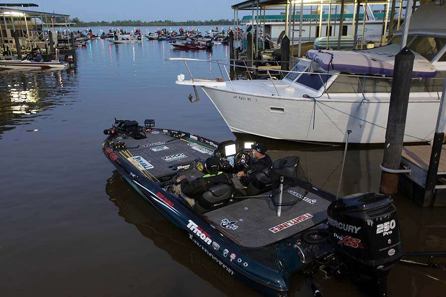 Brent Chapman idles out of his boat slip to take his place in line for a day of fishing at parts unknown on the Red River. 