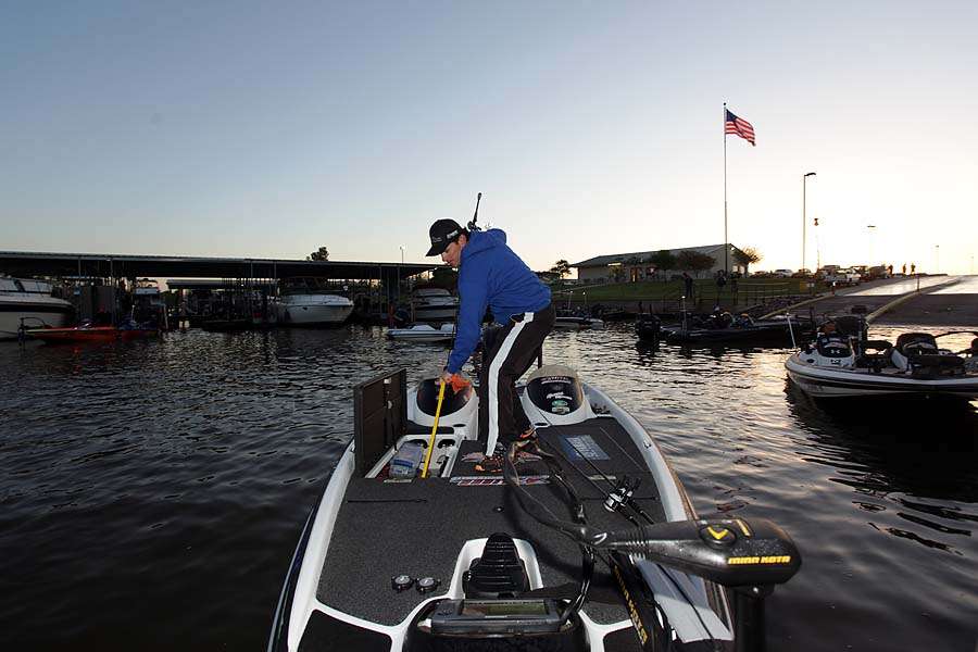 Grant Goldbeck un-sleeves his rods to lay out on the deck for quick access.
