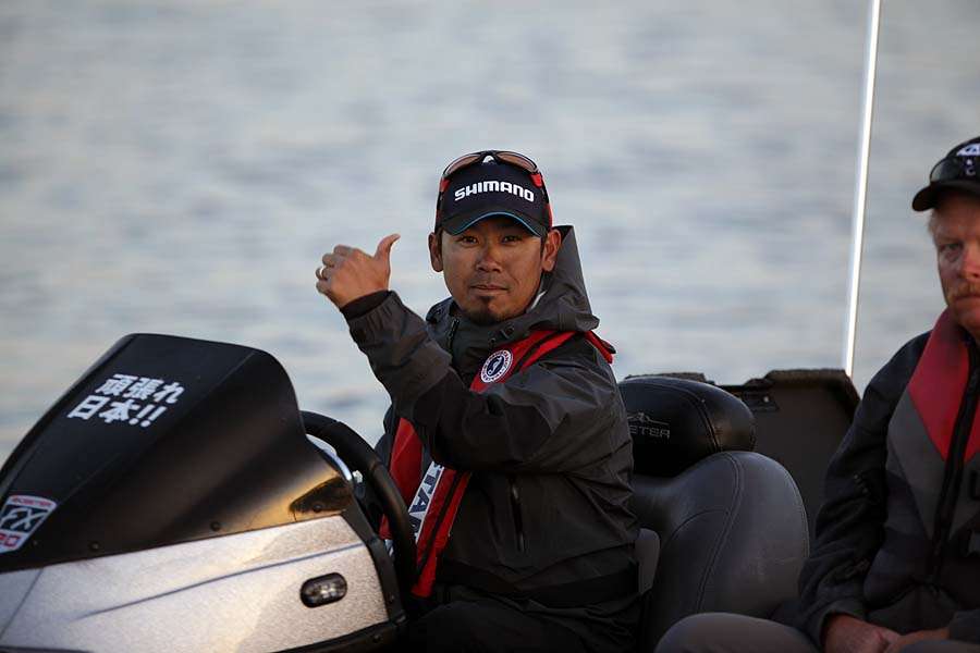 Japanâs Ken Iyobe gives the universal thumbs up as he comes through the safety check line.