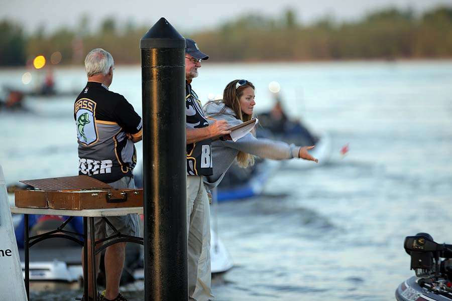 A boat number fob is pitched to a co-angler as his partner drives the boat past the final safety check. 