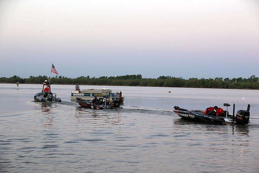 And the other boats file behind for a day of fishing on the Red River.