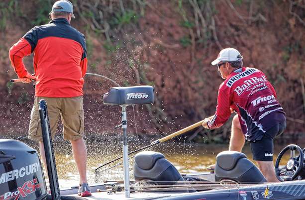 Co-angler Keith Glasby was paired with Stephen Browning on the final day. Browning reaches to net a fish for Glasby.
