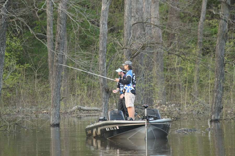 McNeese State University anglers make their way through the woods. 
