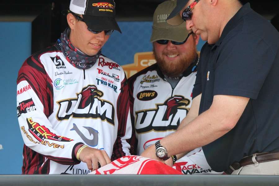 The ULM team of Trapper Munn and Dustin Perkins step to the scales. 