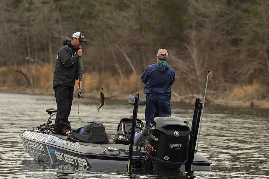 Todd Faircloth pulls a lunker into the boat.