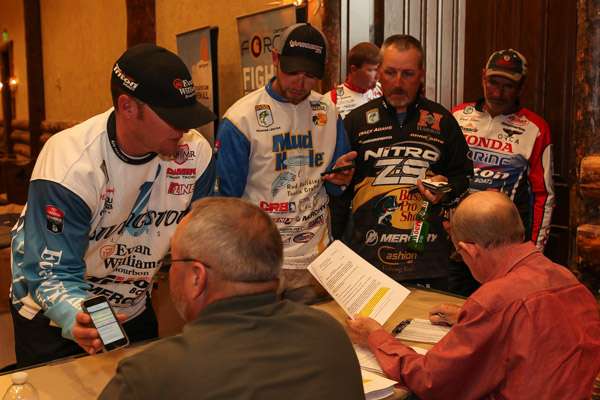 The staff checks the anglers' licenses as they roll in.