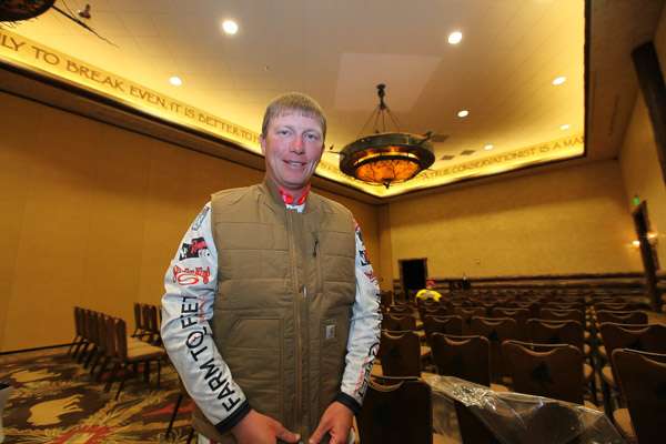 Andy Montgomery has arrived early and is trying on his new Carhartt vest given to each angler.