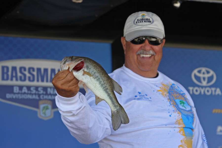 <p>Ricky Harp shows off the dayâs smallest bass â a sporty 1-pound, 3-ounce fish.</p>
