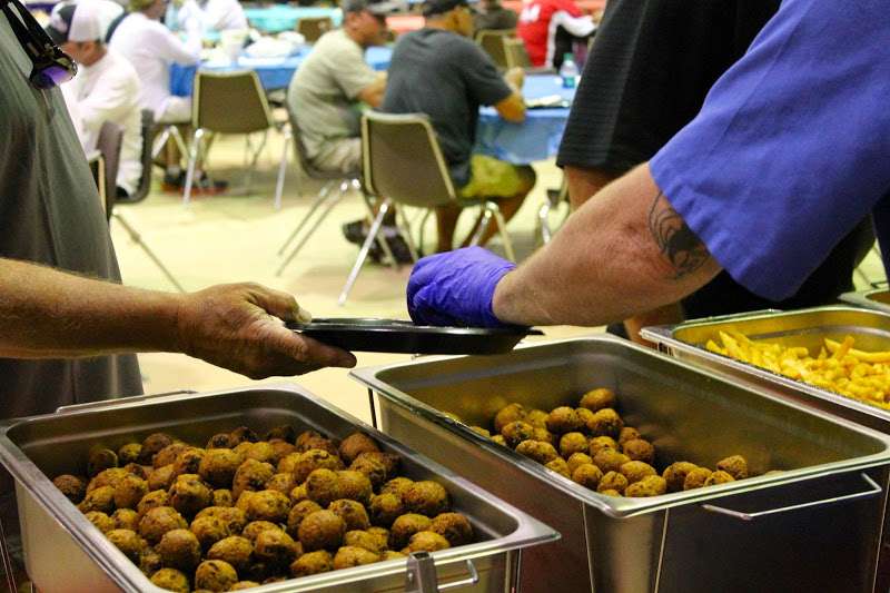 <p>Ah, food break. Sorry, but I didn't eat lunch. Those round things being handed out are called hushpuppies, now up in Connecticut where I live you don't see them being served much so when I asked...</p>
