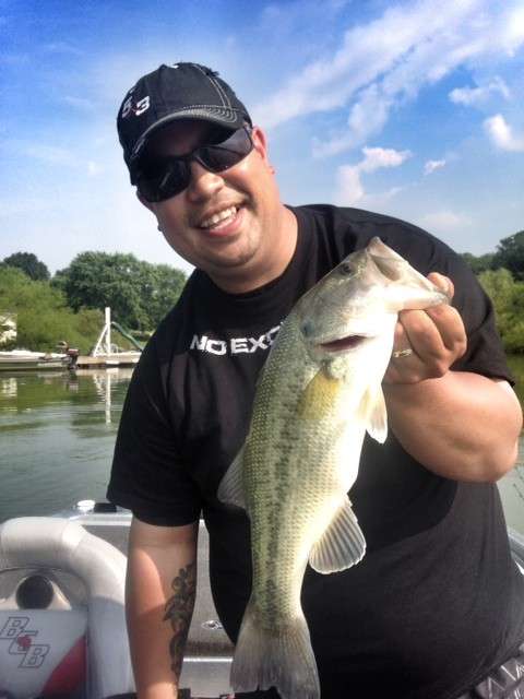 Russ Chargualaf shows off some practice bass.
