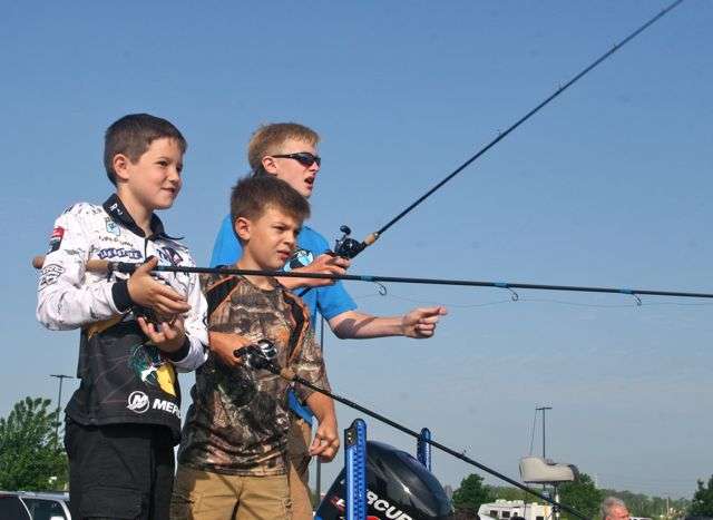 At a free CastingKids event in Rogers, Arkansas, River Clunn, 10, Oakley Howell, 8, and Laker Howell, 12, found plenty of room on the front deck of Randy Howell's boat for all three to cast.