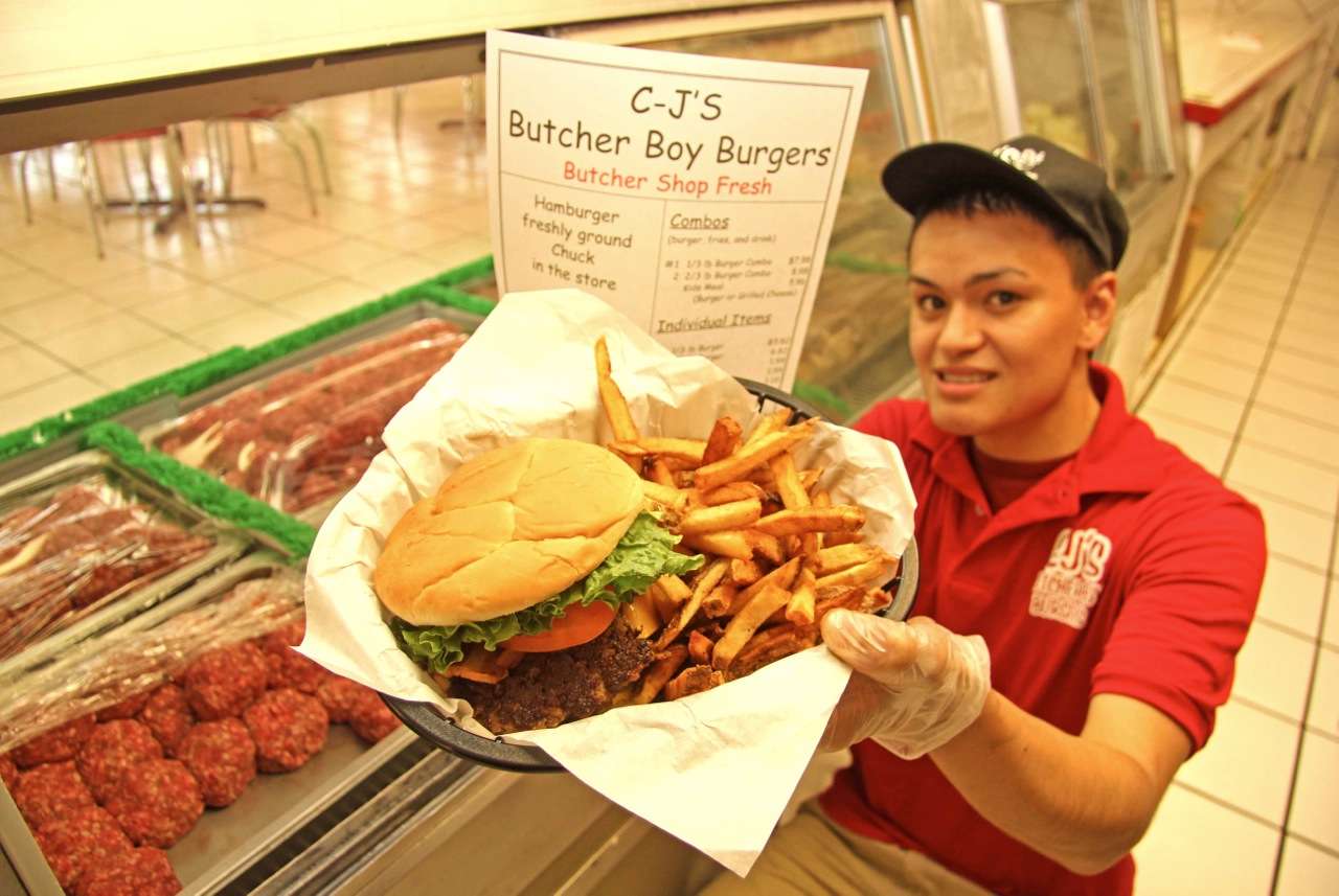 <b>One</b> place you should plan to eat when in Russellville, Arkansas at Lake Dardanelle: CJâs Butcher Boy Burgers. Located at Exit 81 on I-40, 2803 N. Arkansas Ave. You know itâs good when you get to see all the fresh ground chuck in a meat counter display before they toss it on the grill. Very clean inside. Decorated with a 1950s theme and music playing overhead. Fresh cut fries too. 