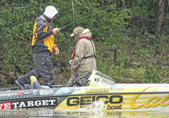 With the fish thrashing, Walker goes back to the front of the boat.