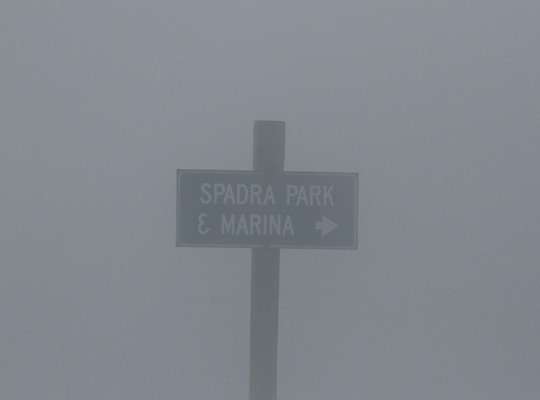 Fog shrouds the Spadra park sign during the morning hours of Day 1 at Lake Dardanelle.