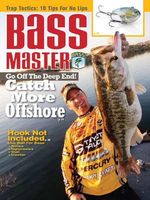 Elite Series pro Gerald Swindle hoists at 12-pound bass caught in deep water on the June 2009 cover. (Photo by Gary Tramontina)