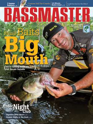 Gerald Swindle, one of the funniest anglers in the Elite Series, knows that tiny topwaters can often land big bass. On the July/August 2012 cover, he shows off a lunker he caught using puny plugs. (Photo by Laurie Tisdale)
