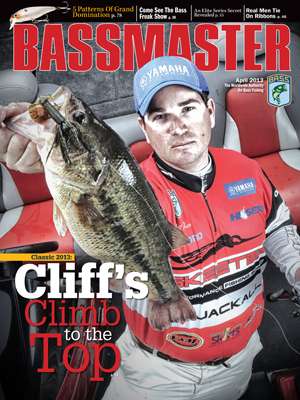 Cliff Pace, the 2013 Bassmaster Classic champion, shows off a trophy he caught while fishing the cold waters of Grand Lake in Oklahoma on the April 2013 cover. (Photo by Gary Tramontina)