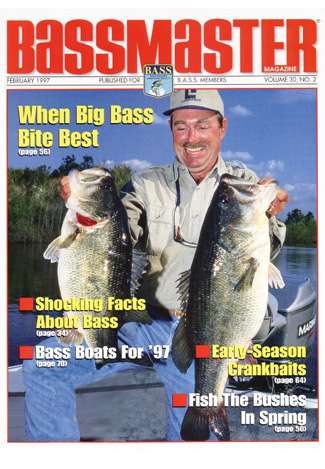 Shaw Grigsby shows off two lunkers, one 8 1/2 pounds, one 12 pounds, on the cover of the February 1997 issue. (Photo by Tim Tucker)