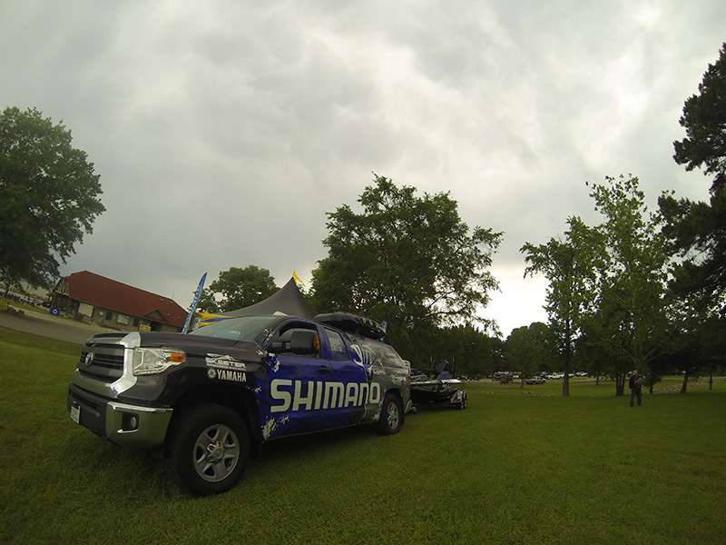 Clouds loom over the Shimano truck and boat.