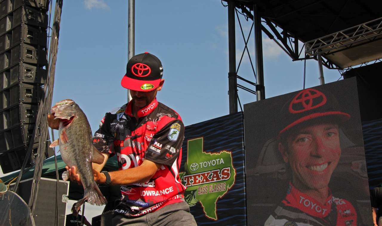 Iaconelli hoists his fat green Lake Fork bass up for thousands of fans at the outdoor weigh-in. 