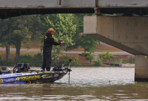 Rick Morris makes a cast under the bridge. The next few photos show the fight with a fish that would ultimately never make it in the boat.
