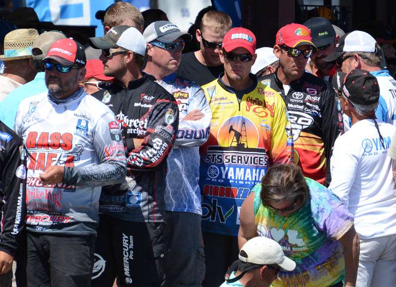 A line of famous fishermen, waiting on a weigh-in bag. 