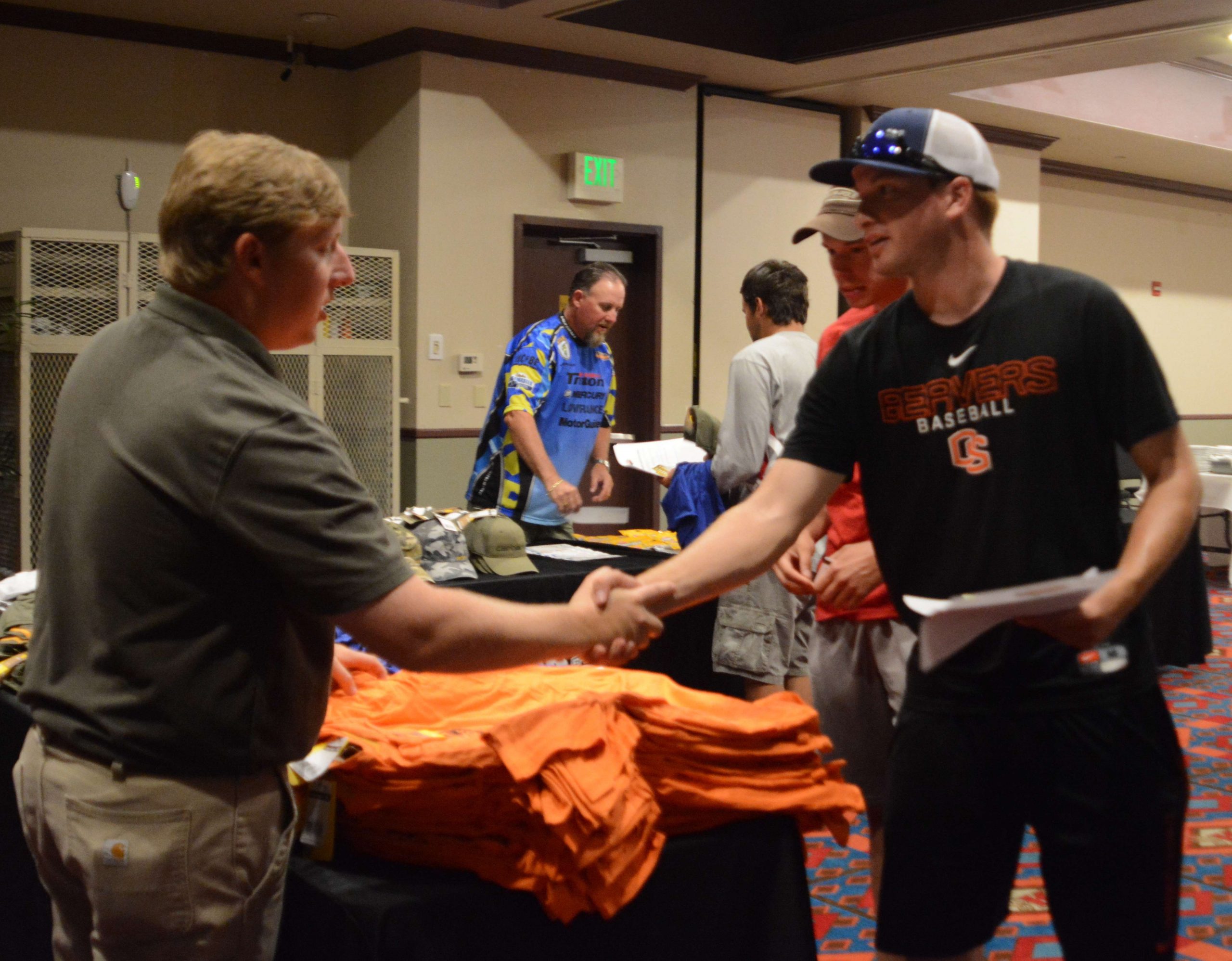 Hank Weldon, College B.A.S.S. manager, welcomes anglers to the sponsor table at registration.