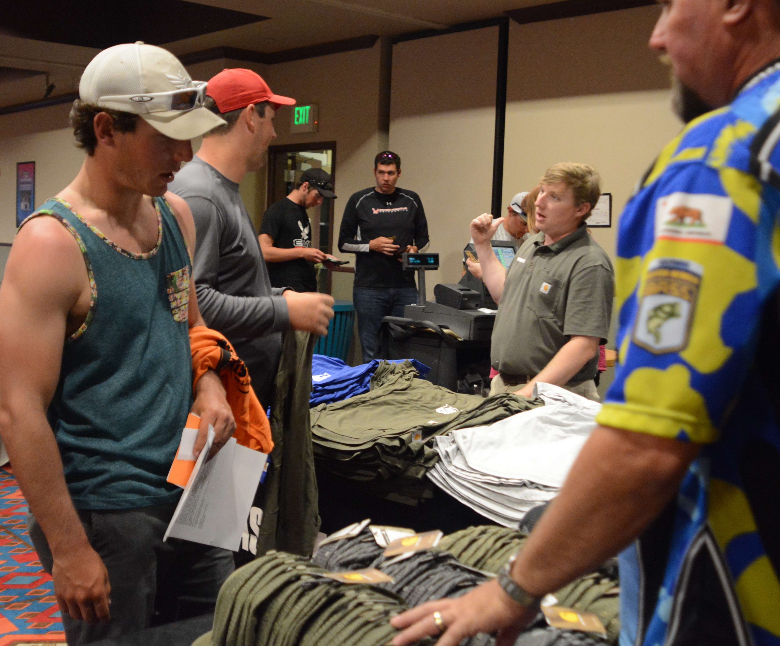 Anglers gather around and collect their swag.