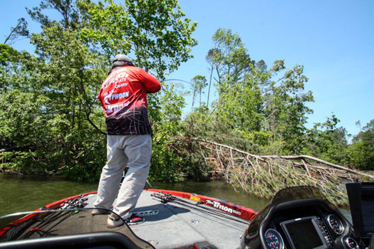12:04 p.m. Horton sets the hook on a bass that ate his swim jig in a laydown tree.
