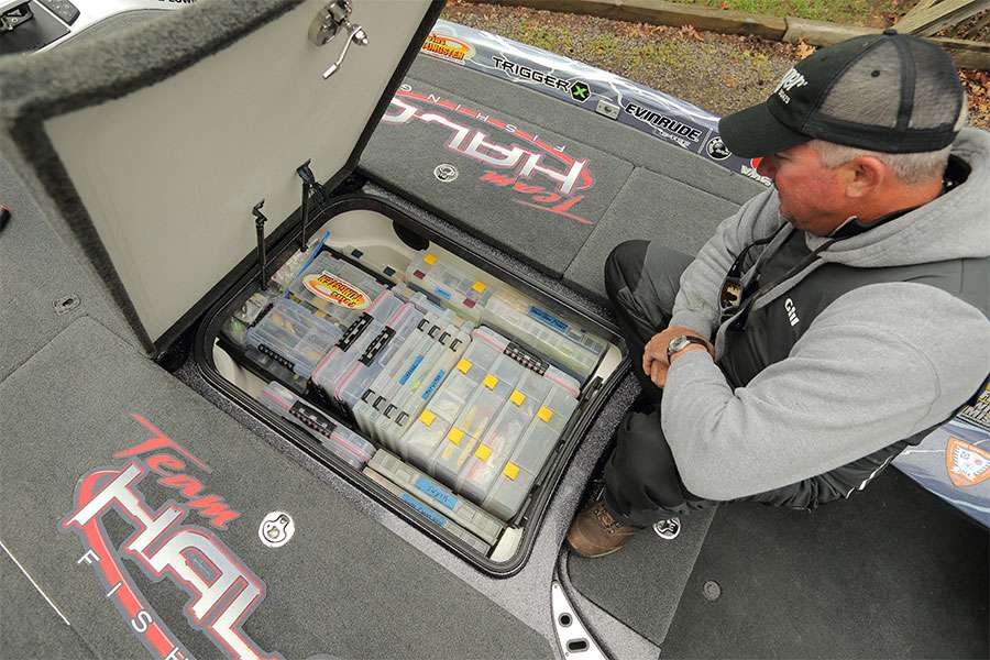 In the center console, he keeps his lures and terminal tackle in plastic tackleboxes. Some boxes stay in all the time, many of them come in and out depending on where he is fishing.