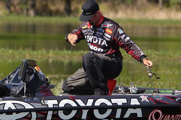 â¦and safely sits the fish down at his feet.