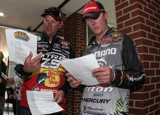 Kevin and Jonathon VanDam look over the rules for Lake Dardanelle. 