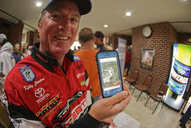 Kelly Jordan shows the picture of a bass jumping he was fighting during the three day practice period. 