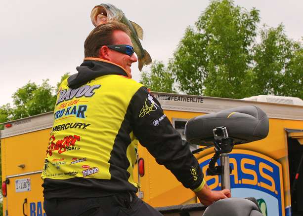 Skeet Reese holds up a Lake Dardanelle bass for the crowd.