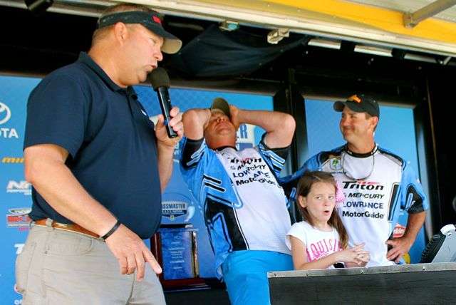 Louisiana angler Dave Cavell reacts upon learning he caught enough weight to qualify for nationals, narrowly edging out teammate Robbie Latuso (right). Cavell placed seventh in the Central Divisional; Latuso placed eighth. Also pictured are Jon Stewart, B.A.S.S. Nation Tournament Director, and Cavellâs daughter, Chloe.