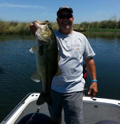 Tony Quick, a longtime contractor for bass, caught this monster on Clear Lake. The fishing trip was a welcome diversion after driving the B.A.S.S. tournament trailer 2,500 miles from Birmingham, Ala., to northern California.