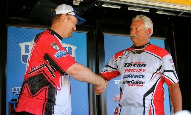 Texas angler Trevor Rogge (left) congratulates teammate Albert Collins, upon learning that Collins caught more weight and will represent their state at nationals. Rogge finished 4th on Eufaula, just six ounces behind Collins, who caught 14 bass for 36-7.