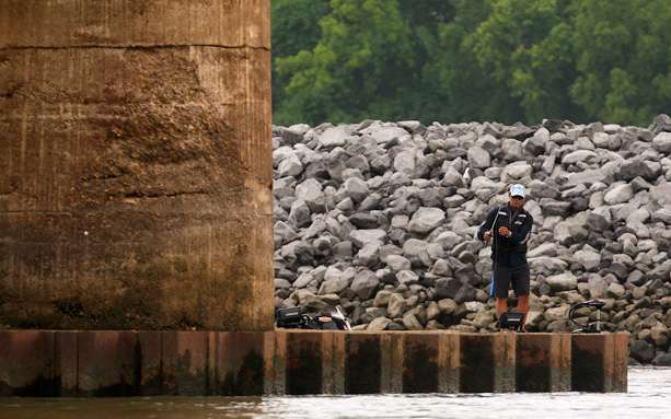 Byron Velvick works a bait around a bridge pier. 