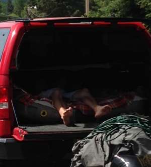â¦ while Chase Heaton, who has driven from Spokane to volunteer at the tournament, naps in his truck before weigh-in.