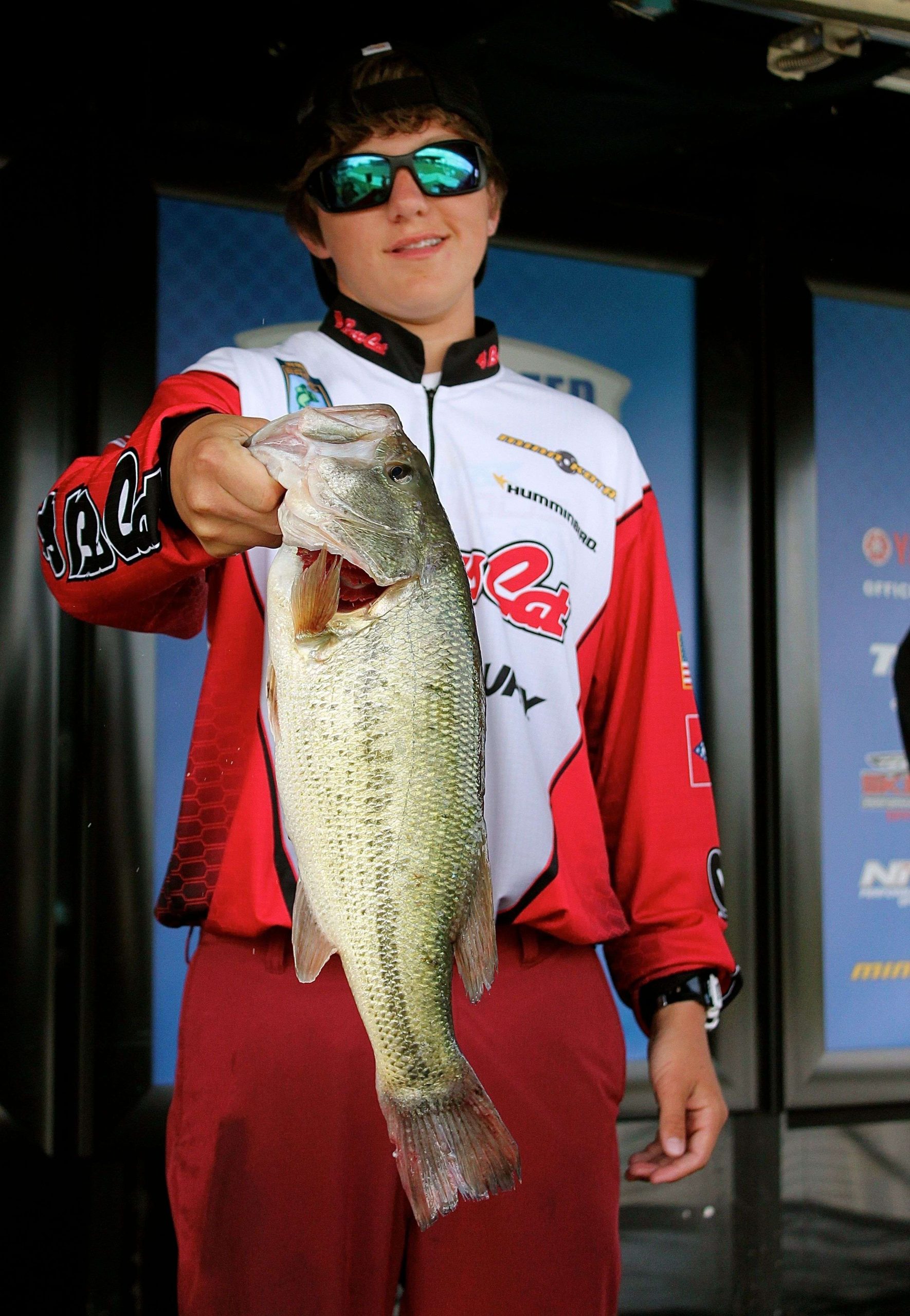 In a new B.A.S.S. Nation tournament format, two high school anglers fish together for the last two days of the three-day divisional tournaments and their combined catches are added to their stateâs team. Here, Arkansas high school angler Calvin Neff hoists a big Lake Eufaula largemouth during the Central Divisional. 
