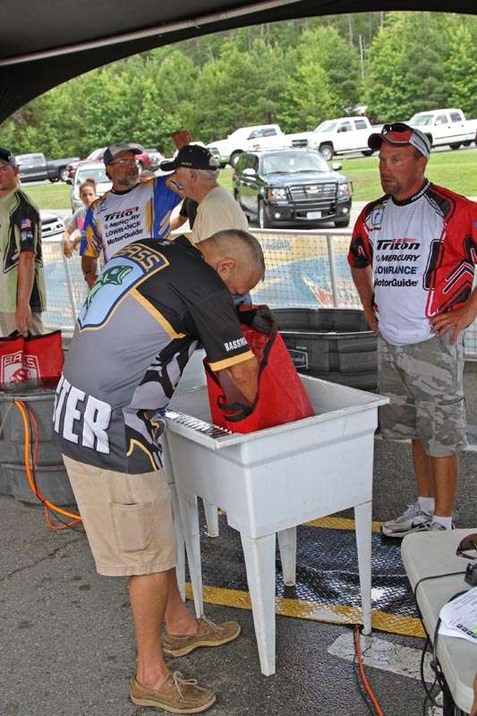 Pennsylvania competitor Mike Moran gets his fish checked before the weigh-in.
