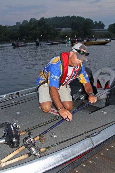 Delawareâs Mark Hogan arranges his rods for the dayâs action.