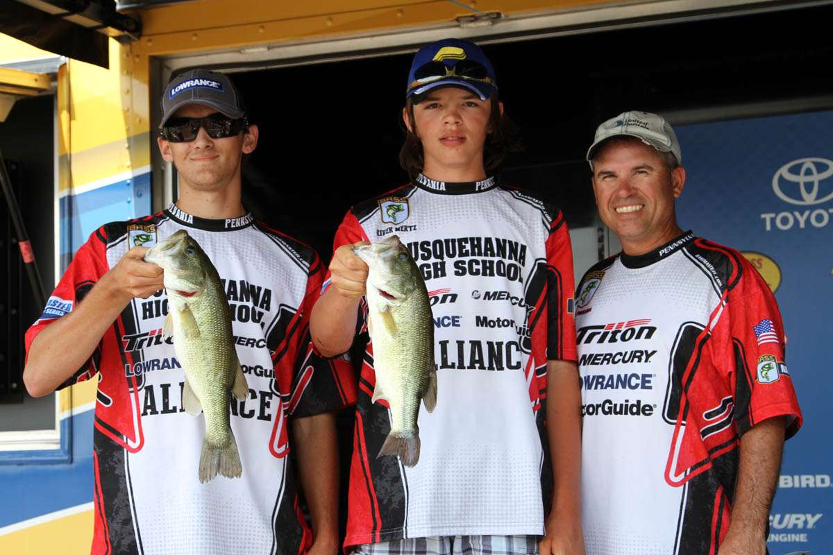 Joined by Coach Mark Melaga, right, Pennsylvania high schoolers Trent Gower and River Mertz fished jigs around docks on Day 3.