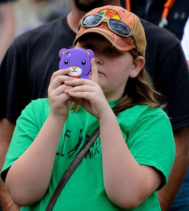This young fan has an interesting phone case. 