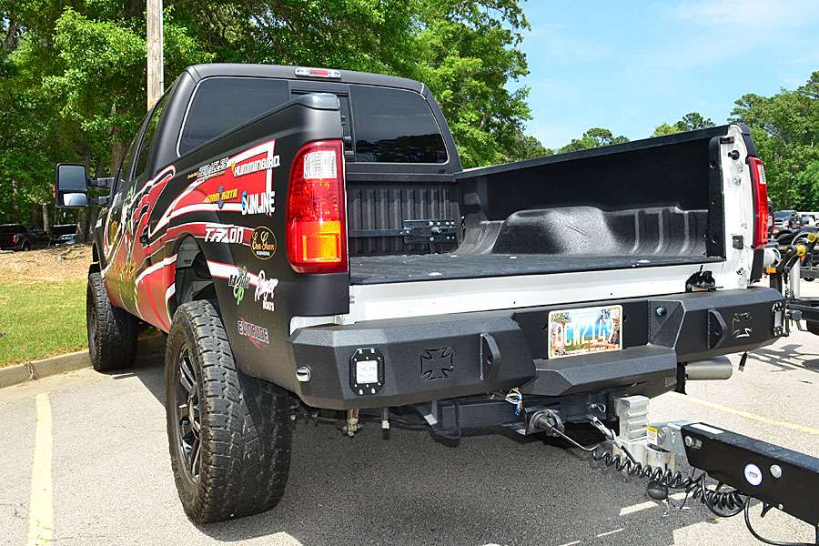 The tailgate is removed to accommodate his camper which goes in the bed. Note the custom bumper cutouts for Rigid lights.