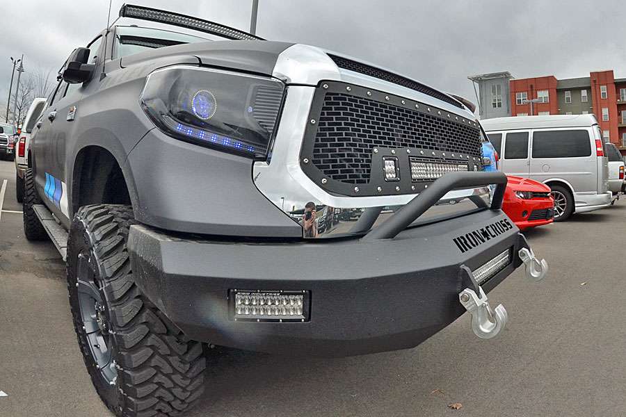 This highly customized GoPro Tundra was spotted at the Bassmaster Classic this past February. It sports an Iron Cross Automotive bumper and buckets of Rigid Industries LED lights as well as a lift kit with big tires and wheels. The matte black wrap doesn't look half bad, either. The tow hooks are from Monster Hooks.